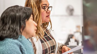Two women reviewing a document
